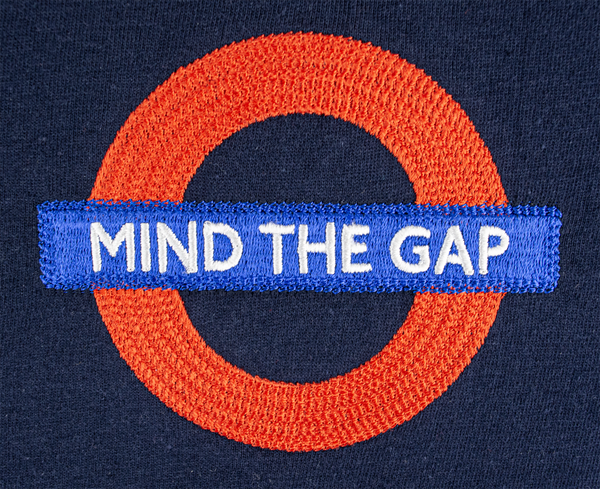 GWCC Licensed Unisex Mind The Gap Chain Stitch Embroidery T-Shirt Underground Navy (XS)